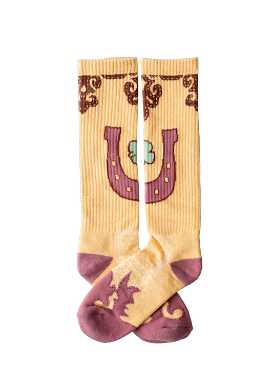 Beige and maroon sock with horseshoe and shamrock design on a white background