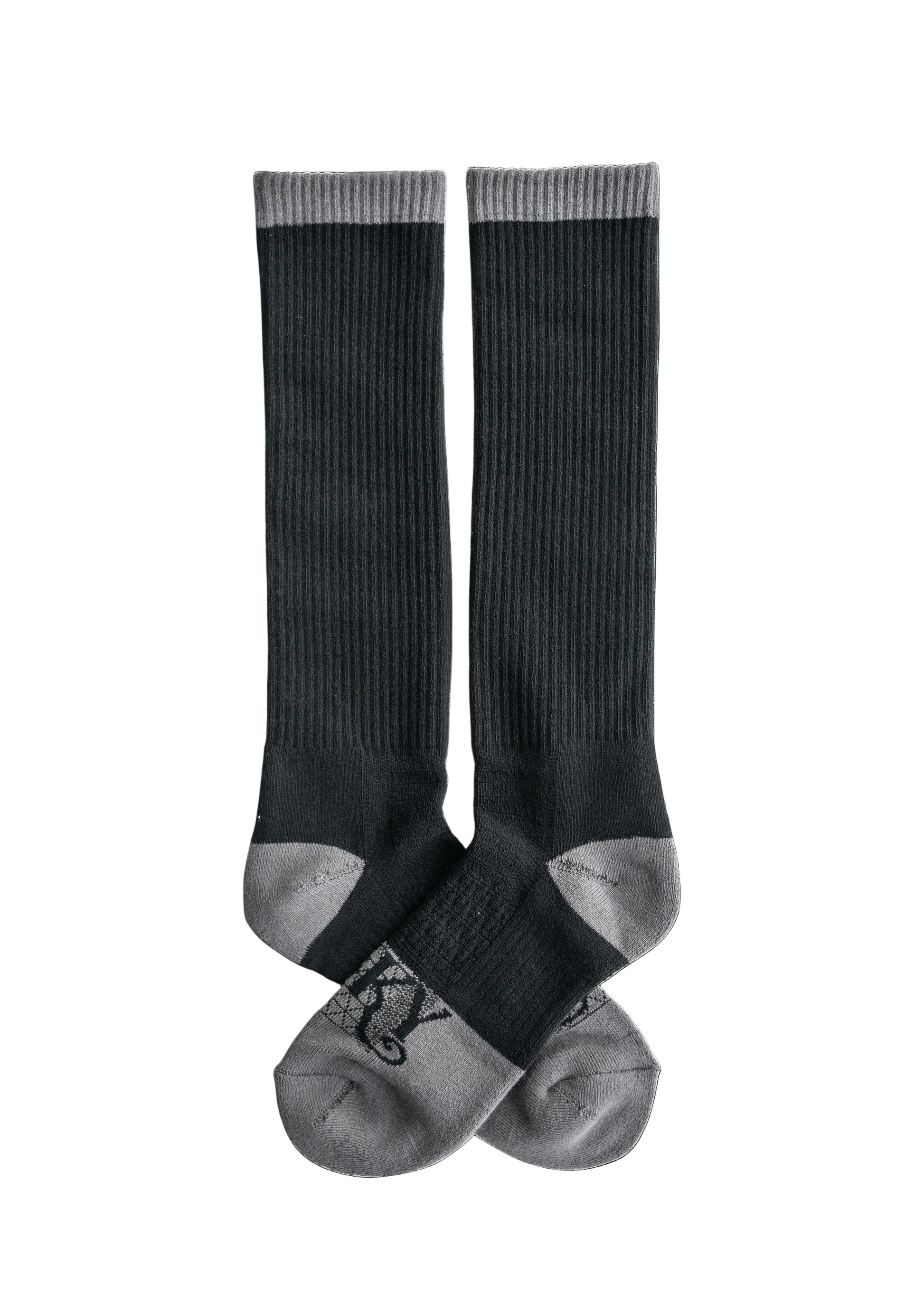 Pair of black knee-high socks on a white background