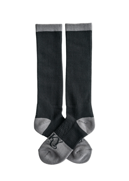 Pair of black knee-high socks on a white background