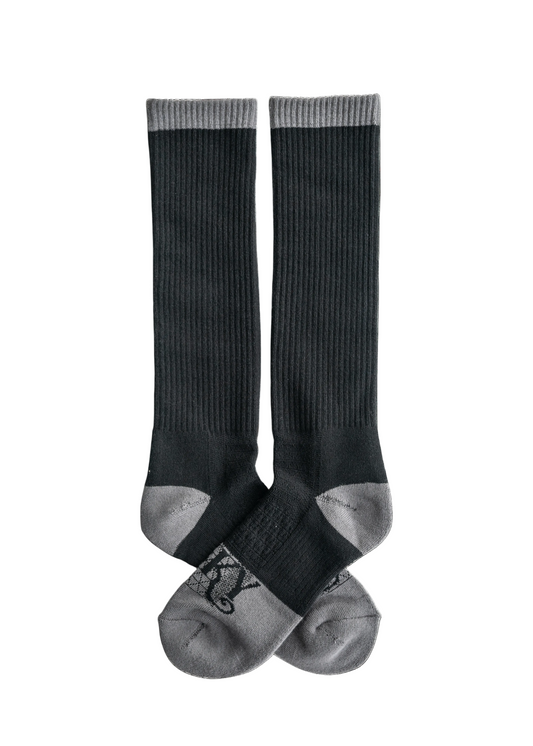 Pair of black knee-high socks on a white background