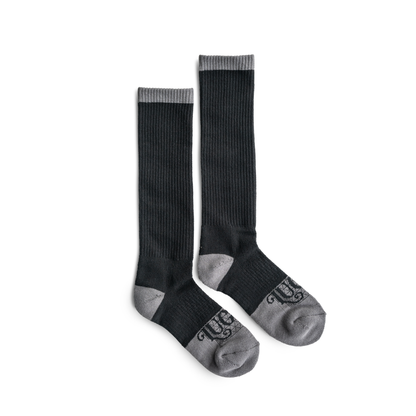 Pair of black knee-high socks with gray accents on a white background